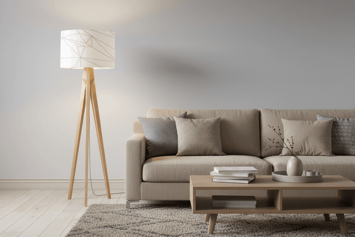 Stylish Shadow Bright lampshade on a wooden tripod floor lamp in a modern living room