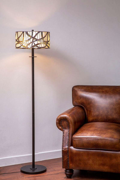 Orsina Floor Lamp with Unique Shade Design beside a Brown Leather Sofa in a Comfortable Living Room