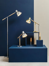 Orsina Floor Lamp collection with stylish designs in gold and chrome finishes on a navy background