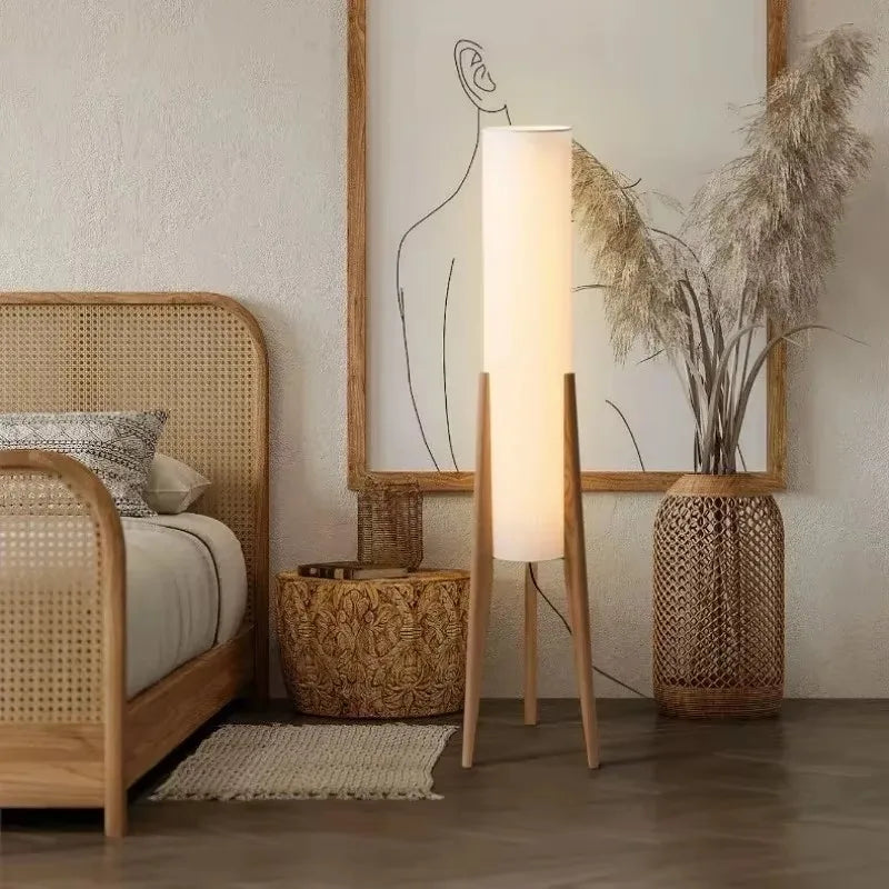Nisu Home Floor Lamp with a minimalist design, complementing a stylish bedroom setting