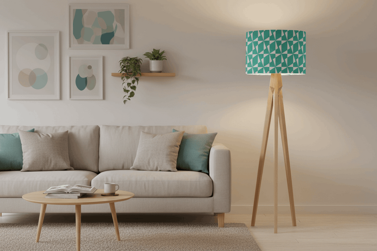 Stylish Shadow Bright lampshade in teal geometric pattern on wooden floor lamp in a modern living room