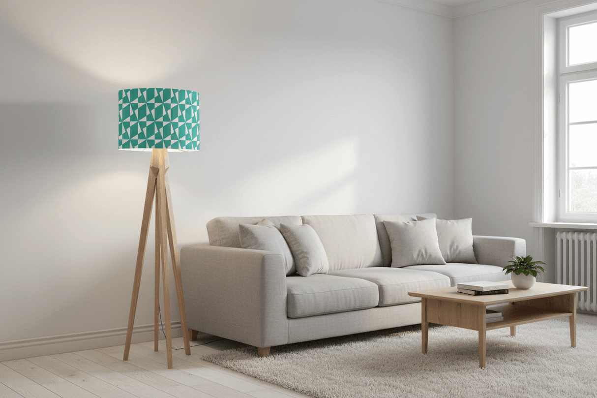 Shadow bright lampshade in geometric teal design above a modern floor lamp in a stylish living room
