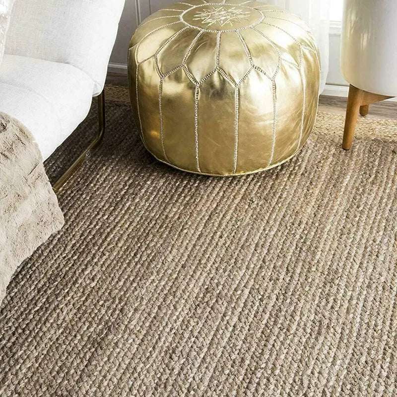 Stylish Nisu Home Floor Rug with a textured design under a modern sofa and pouf