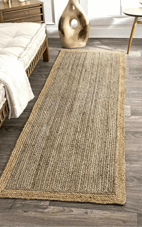Natural Jute Floor Rug with a Braided Edge, perfect for adding warmth to any living space