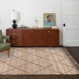 Nisu Home Floor Rug in a natural weave with a geometric pattern on a wooden floor
