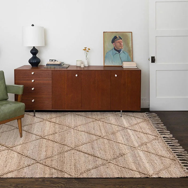 Nisu Home Floor Rug in a natural weave with a geometric pattern on a wooden floor
