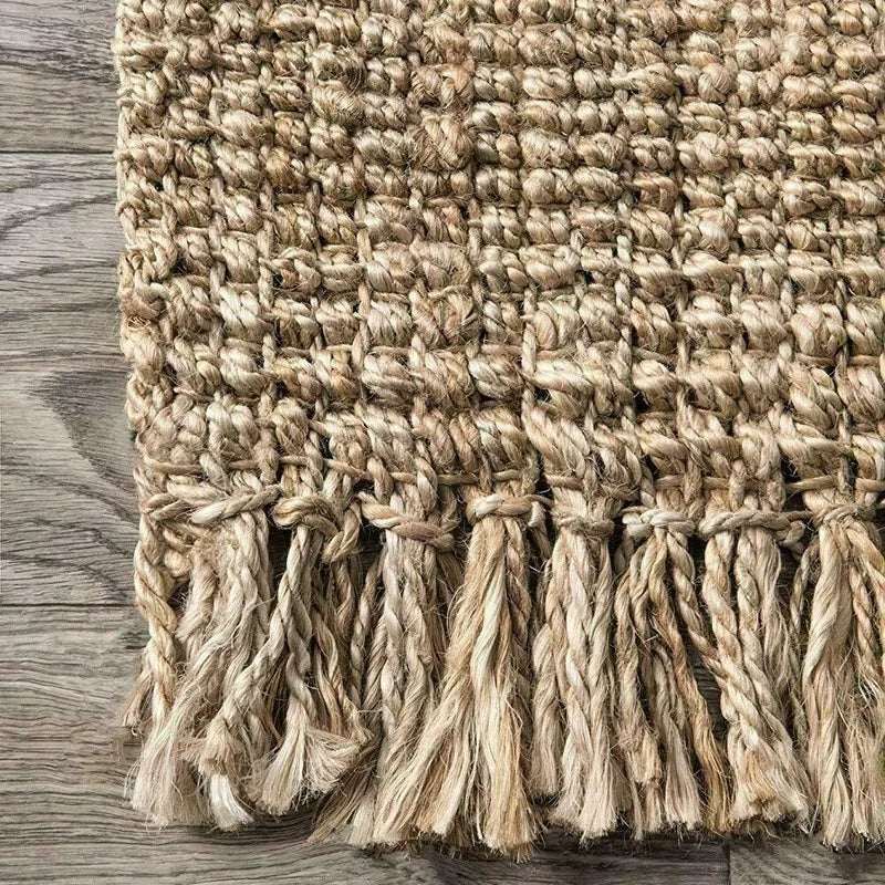 Natural woven Nisu Home floor rug with fringed edges for a bohemian touch