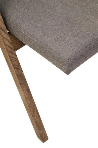 Orsina Folding Chair featuring a plush grey cushion and stylish wooden legs for modern interiors