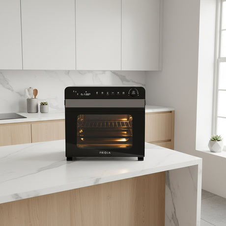 Fridja Digital Air Fryer with a sleek design and visible cooking chamber in a modern kitchen setting