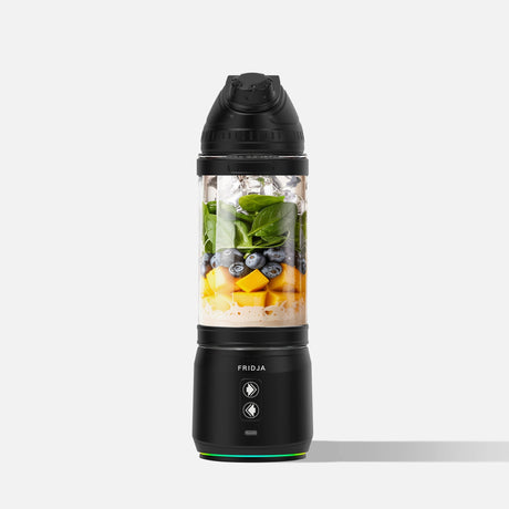 Fridja Portable Blender with ingredients like fruits and greens for on-the-go smoothies