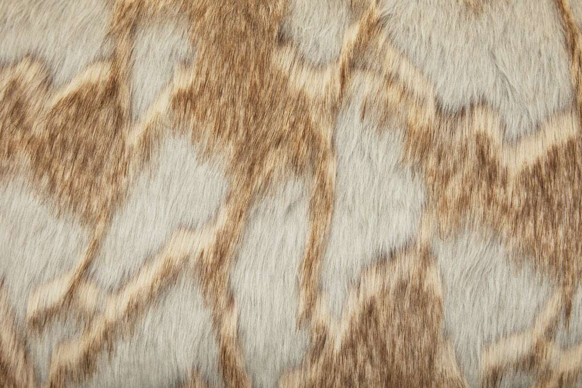 Close-up of Orsina Fur Cushion with a stylish animal print pattern in soft tones