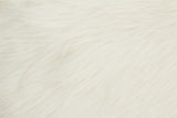 Soft and fluffy Orsina fur cushion in a creamy white shade for luxurious home decor