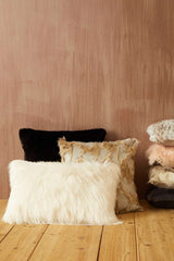 Orsina Fur Cushion collection featuring various styles and colours on a wooden surface