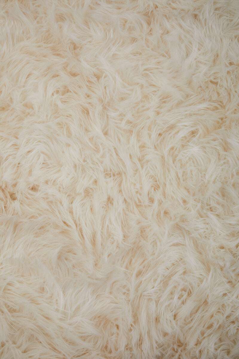 Soft and fluffy Orsina Fur Throw in cream colour for cosy home decor
