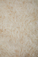 Soft and fluffy Orsina Fur Throw in cream colour for cosy home decor