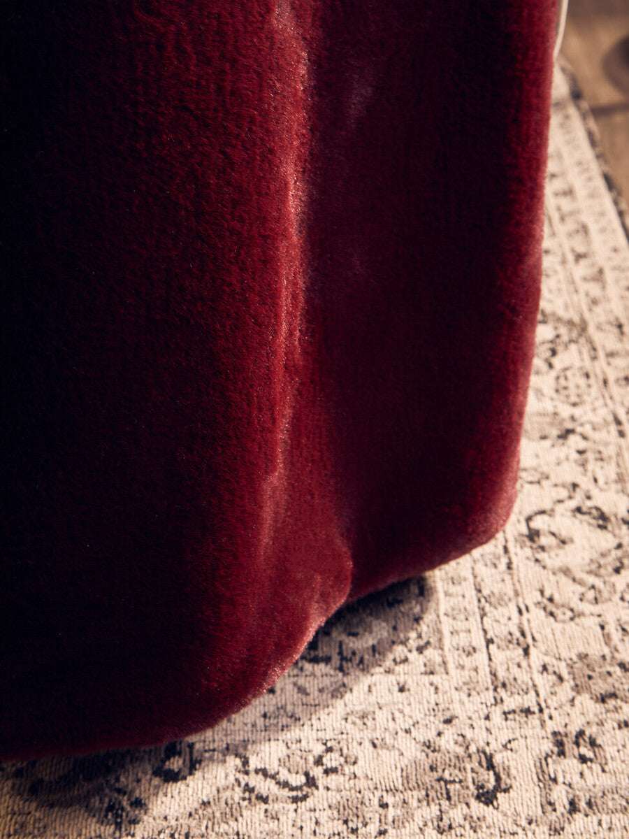 Luxurious Orsina fur throw in deep red, perfect for adding warmth and style to any room