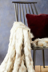 Orsina luxurious fur throw draped on a modern chair, perfect for adding warmth to any space
