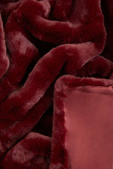 Rich burgundy Orsina Fur Throw made from soft faux fur for cozy warmth and style
