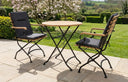 MINT Outdoor Garden Dining Set with two stylish chairs and a round table in a scenic garden