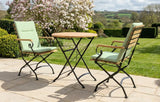 MINT Outdoor Garden Dining Set with two folding chairs and a round table in a scenic outdoor setting