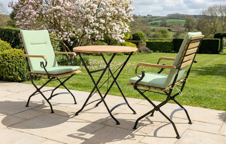 MINT Outdoor Garden Dining Set with two folding chairs and a round table in a scenic outdoor setting