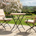 MINT Outdoor Garden Dining Set with Two Stylish Chairs and a Round Table in a Beautiful Garden Setting