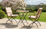 MINT Outdoor Garden Dining Set with Two Stylish Chairs and a Round Table in a Beautiful Garden Setting
