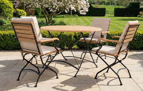 MINT Outdoor Garden Dining Set with a round wooden table and four stylish folding chairs