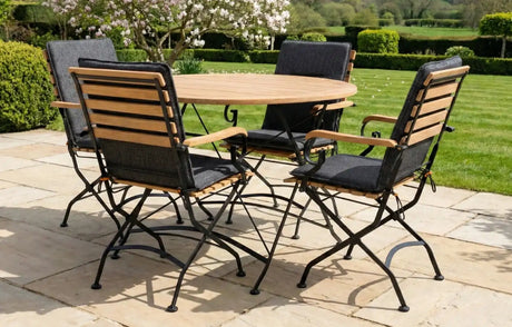 MINT Outdoor Garden Dining Set featuring a round wooden table and five foldable chairs for outdoor gatherings