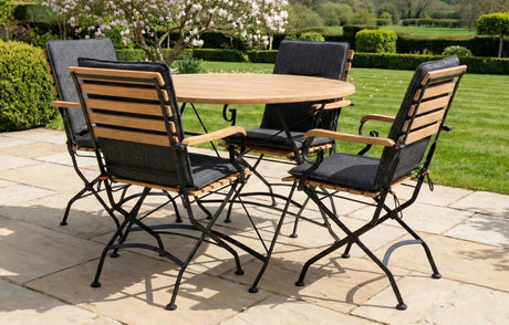 MINT Outdoor Garden Dining Set featuring a round wooden table and five foldable chairs for outdoor gatherings