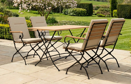 MINT Outdoor Garden Dining Set with a wooden tabletop and cushioned folding chairs for outdoor dining