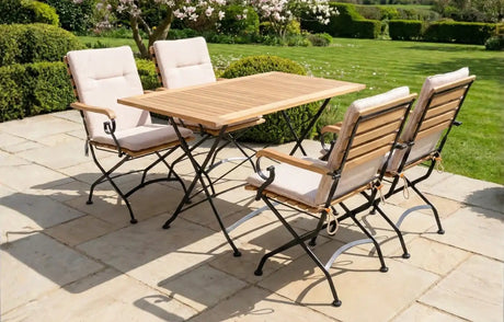 MINT Outdoor Garden Dining Set with Wooden Table and Four Comfortable Chairs in a Scenic Garden