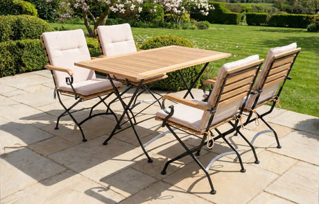 MINT Outdoor Garden Dining Set with Wooden Table and Four Comfortable Chairs in a Scenic Garden