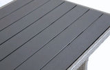 Close-up of MINT Outdoor dining set table with sleek grey slatted surface and woven rattan details
