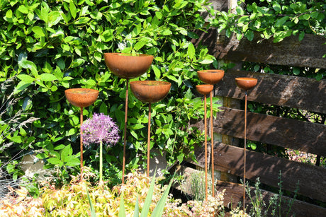 Stylish garden Rain Catcher with multiple bowls on stands for elegant water collection