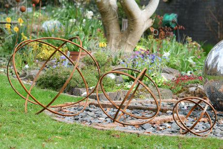 Rustic Garden Sphere Ornaments arranged on the lawn, enhancing garden aesthetics and design