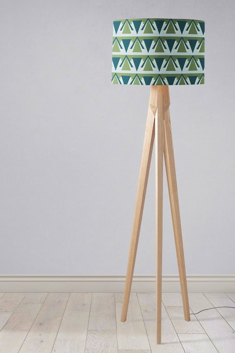 Stylish Shadow Bright lampshade with geometric green pattern on a wooden tripod floor lamp