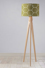 Stylish Shadow Bright lampshade with geometric design on a wooden tripod floor lamp