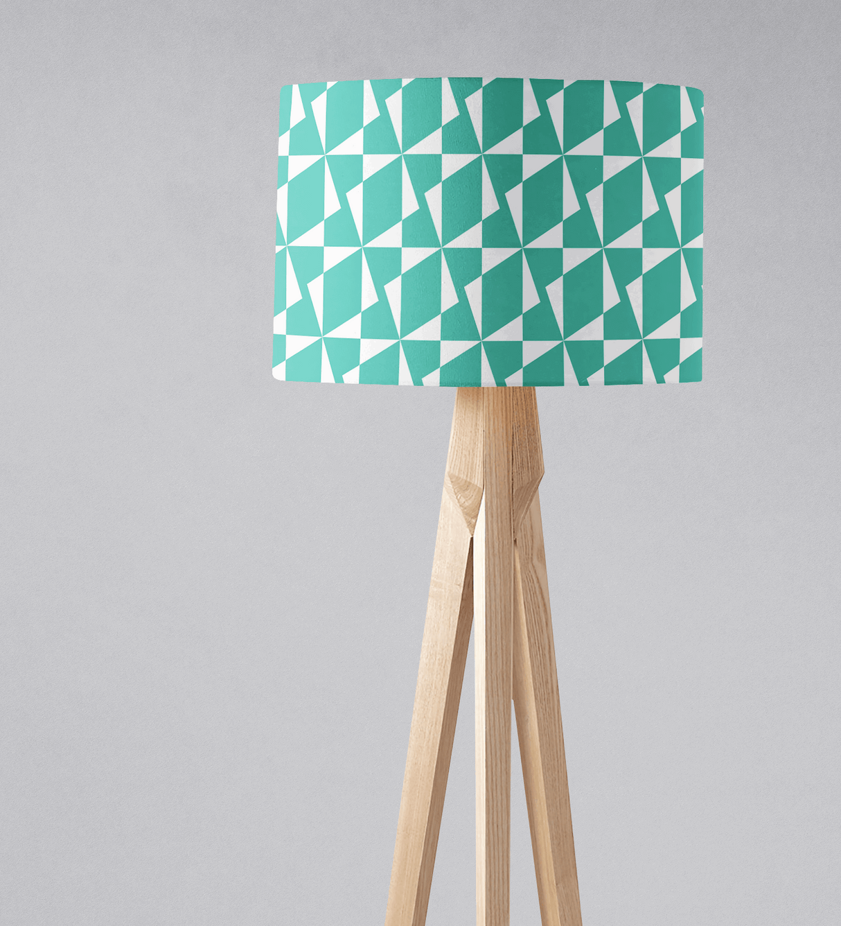 Shadow Bright geometric lampshade in turquoise and white on a wooden tripod lamp
