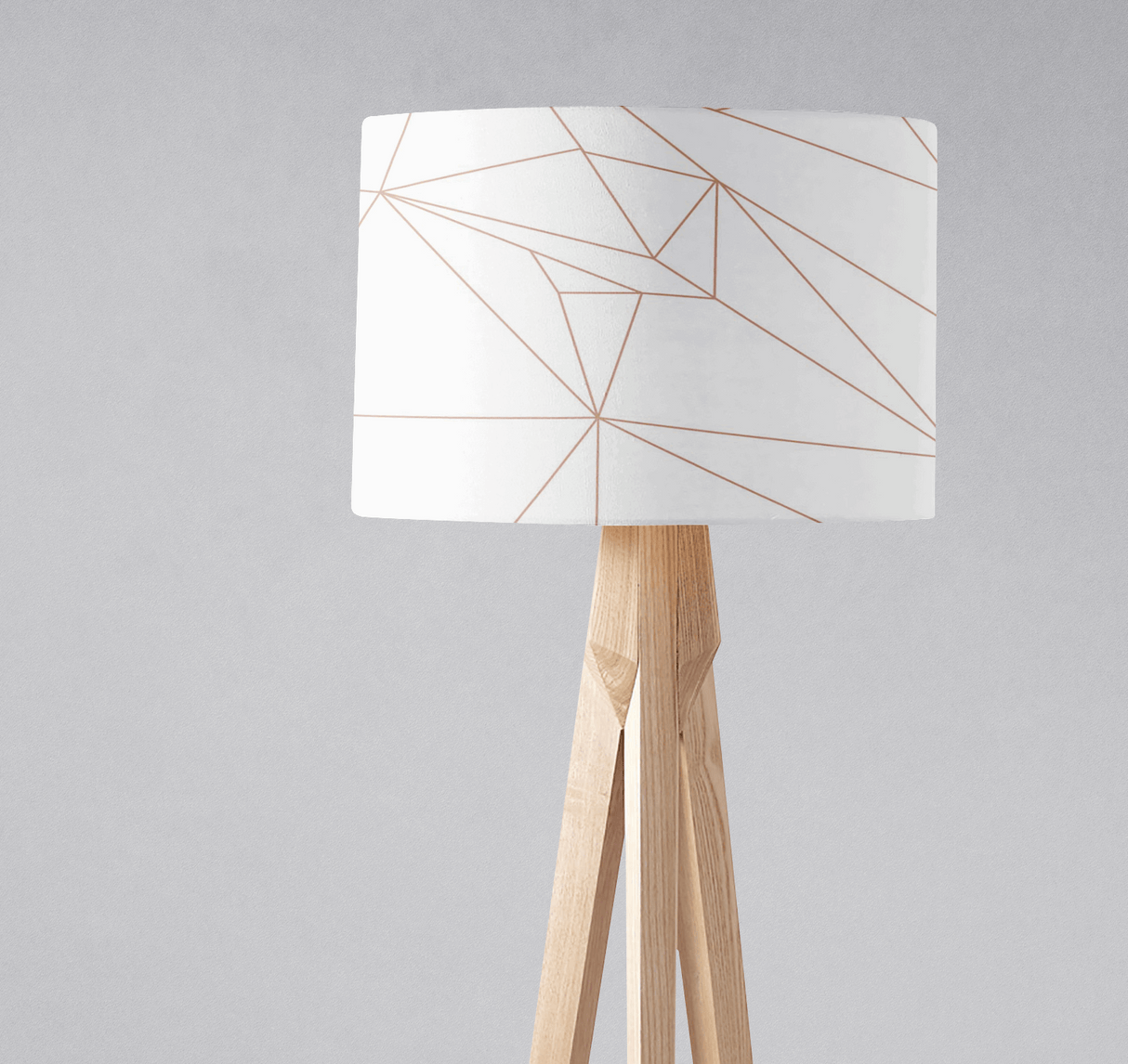 Modern lampshade from Shadow Bright with geometric design on a tripod lamp base