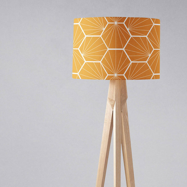 Shadow bright geometric yellow lampshade on a wooden floor lamp for stylish interior lighting