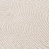 Soft textured geometric rug in light colour with circular patterns for stylish home decor