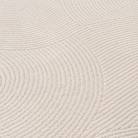 Soft textured geometric rug in light colour with circular patterns for stylish home decor