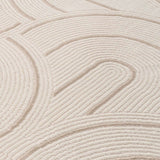 Close-up of a soft cream Geometric Rug with textured patterns for stylish home decor
