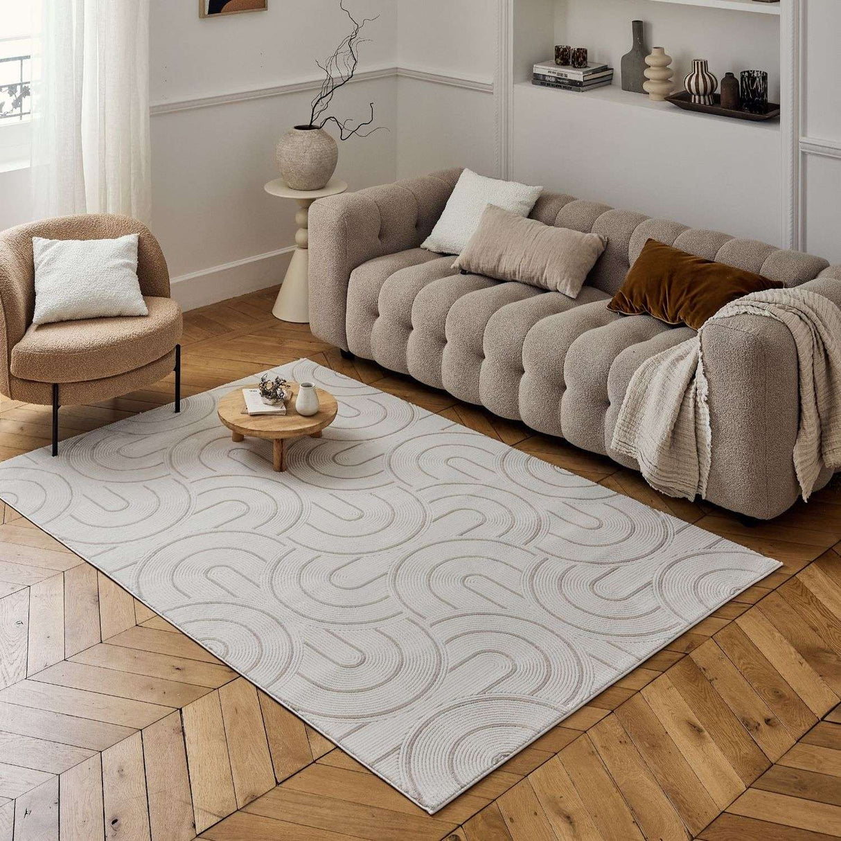 Stylish Geometric Rug in neutral tones, enhancing modern living room with a plush sofa and elegant decor