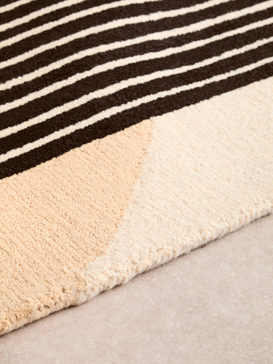 Orsina Geometric Rug with a striped design in earthy tones for modern home decor