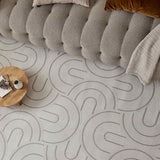Stylish Geometric Rug with soft texture, placed under a modern sofa and coffee table