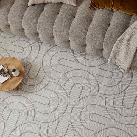 Stylish Geometric Rug with soft texture, placed under a modern sofa and coffee table
