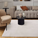 Stylish Geometric Rug in a modern living room with beige furniture and decorative items