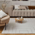 Elegant Geometric Rug in neutral tones enhancing a modern living room with stylish furniture